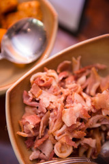 fried bacon in bowl