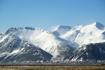 Snow-covered volcanic mountain landscape in Iceland
