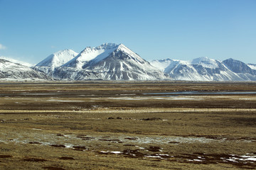 Snow-covered volcanic mountain landscape