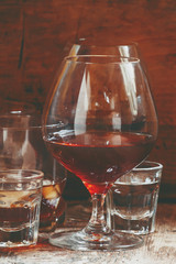 Set of hard liquor brandy, whiskey, brandy and vodka on the old