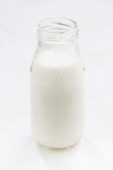 bottle of milk on a white background, closeup