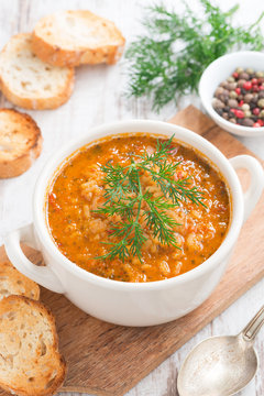 tomato soup with rice, vegetables and bread, top view