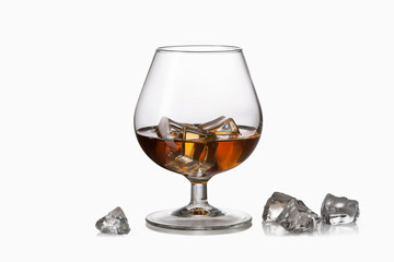 Glass. Whiskey with ice in glass isolated on white background