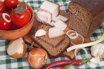 Salted lard with bread ,onion,pepper and pickled tomatoes 
