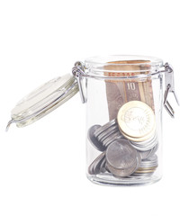 Money Indian Currency Rupee Notes and Coins in a glass jar isola