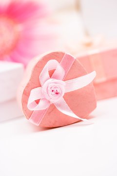 Pink gift box in heart shape