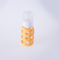 baby glass bottle. baby glass bottle on a background.