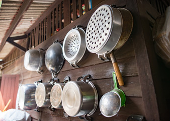 Utensils hanging on a wooden wall