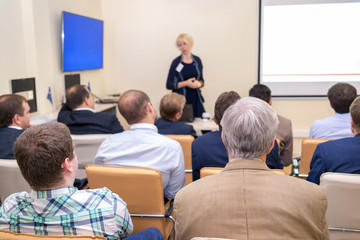 people sitting rear at the business conference
