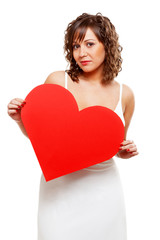 Young woman holding red paper heart