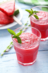 Fresh watermelon juice in the glass on wooden table