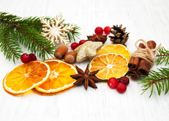 different kinds of spices,  nuts and dried oranges