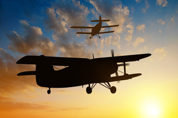 engine airplane flying at sunset