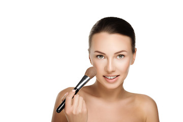 Fototapeta premium young beautiful brunette woman with nude makeup smile and hold brush at face. naturalness isolated photo. 