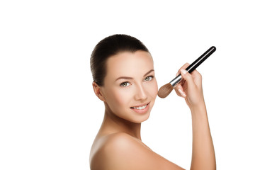 young beautiful brunette woman with nude makeup smile and hold brush at face. naturalness isolated photo.	