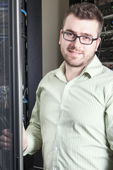 Network engineer working in server room