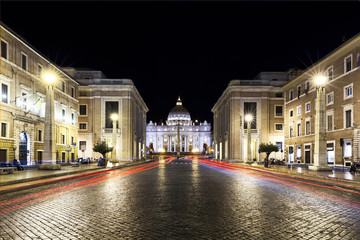 Red car lights in the night front of the Vatican