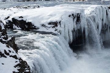 Closeup of frozen waterfall Godafoss, Iceland