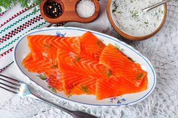 smoked salmon slices with sour cream and dill. rustic style.