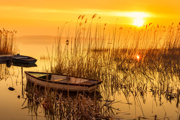 Sunset on the lake Balaton with a boat