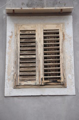 Fototapeta na wymiar Window with old wooden shutters