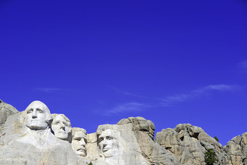 Mount Rushmore National Memorial, symbol of America located in the Black Hills, South Dakota, USA. Image with blue space for added text or for presentations. - obrazy, fototapety, plakaty