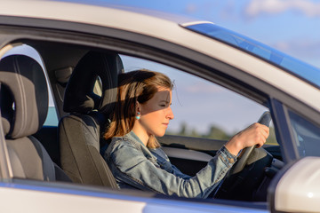 Female driver checking her side mirror