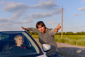 Woman giving directions to a lost driver