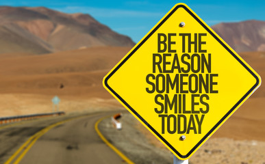Be The Reason Someone Smiles Today sign on desert road