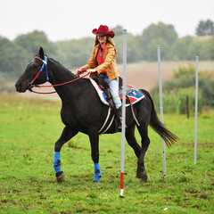 Girl barrel racing