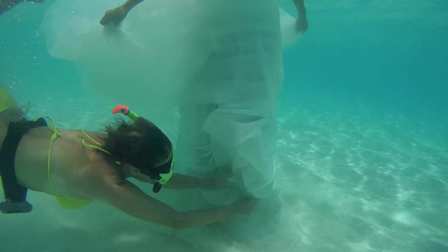 UNDERWATER: Assistant bride prepares for underwater shooting, Indian Ocean, Maldives
