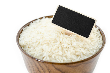 Raw rice and black wooden tag.