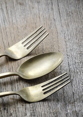 Old brass spoon and fork