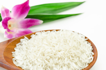 Raw rice jasmine in wooden spoon.