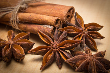 Cinnamon sticks and anise on wooden table, seasoning for cooking