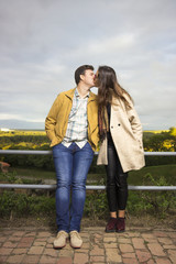 Fototapeta premium Young couple intimate standing next to each other.
