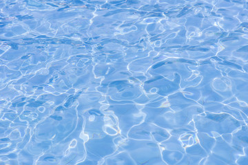 blue swimming pool with sunny reflections