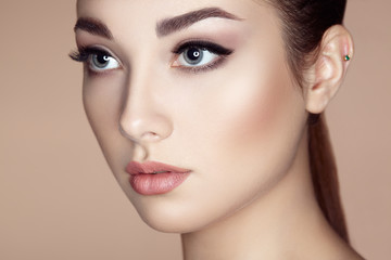 Fototapeta premium Beautiful woman face. Perfect makeup. Beauty fashion. Eyelashes. Lips. Cosmetic Eyeshadow