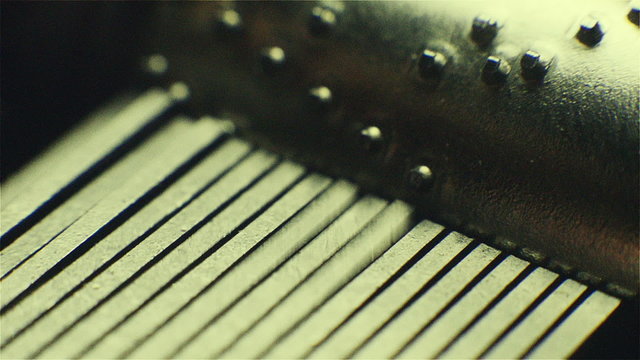 Music Box, a small hand-operated. Close up of roller. Low key record.