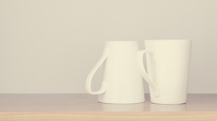 White empty coffee cup  in kitchen cabinet