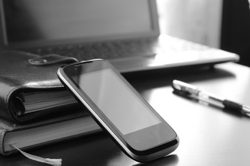 office desk with a computer and a telephone diary