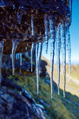 Icicles on a mountain cliff