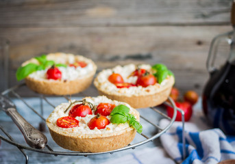 sand tarts with goat cheese and cherry tomatoes, vegetarian food