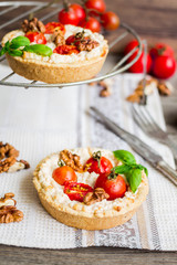 quiche with goat cheese, cherry tomatoes and walnuts, vegetarian