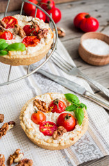 quiche with goat cheese, cherry tomatoes and walnuts, vegetarian