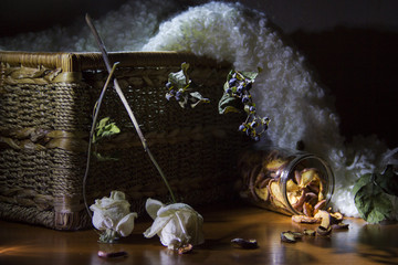 Still life with dry roses and apples.