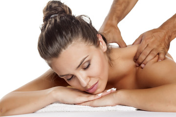 beautiful young woman enjoying the pleasant massage