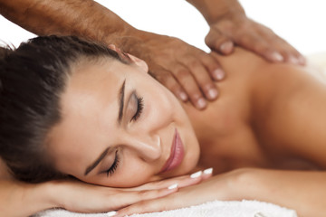 Obraz na płótnie Canvas beautiful young woman enjoying the pleasant massage
