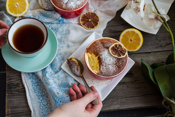lemon pudding with red plates on a white tablecloth