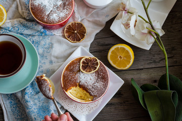 lemon pudding with red plates on a white tablecloth